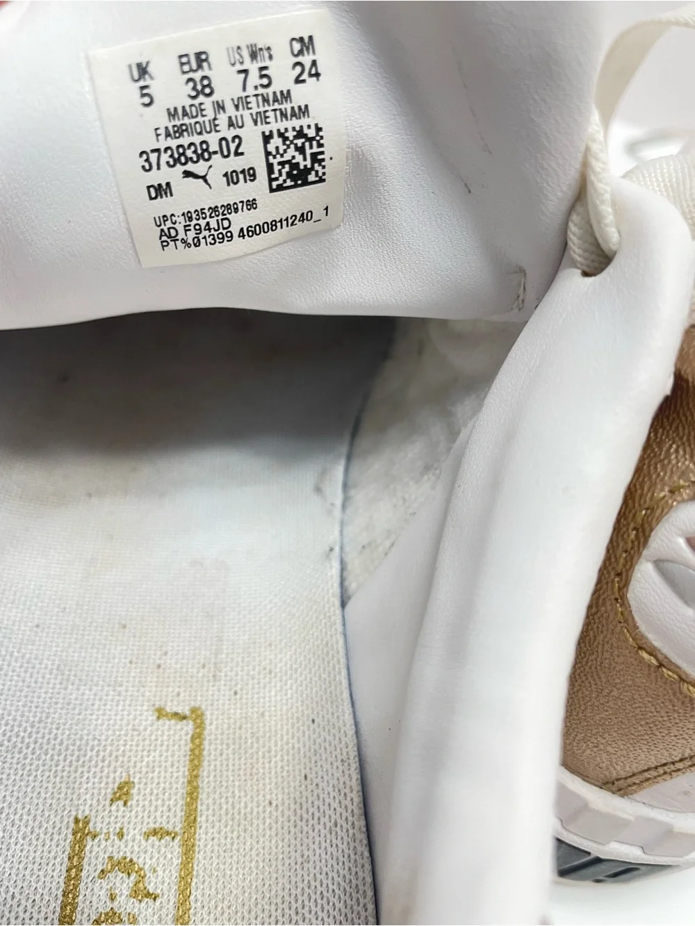 Women’s 7.5 Puma Cali Hacked White with gold and silver accents
